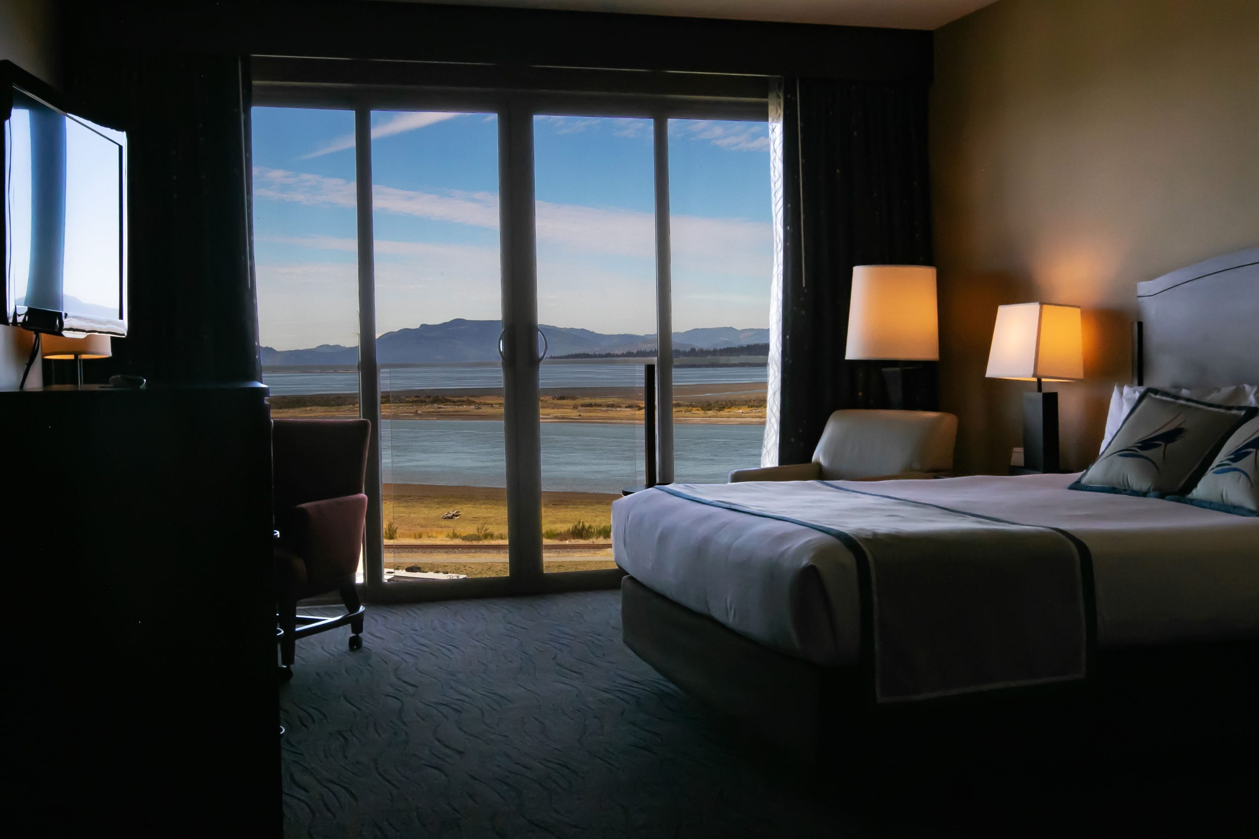 Bay View room with a king size bed, chair, and window view
